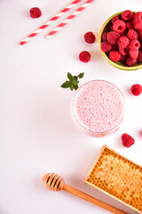Natural healthy smoothie made from raspberry and coconut milk.