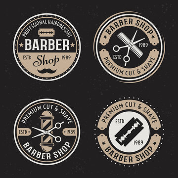 Barber shop set of four vector colored vintage round badges, emblems, labels or logos on dark background