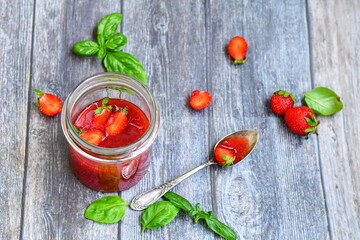 Home made ketogenic   organic  bio strawberry jam and fresh strawberryes  on wooden background. 