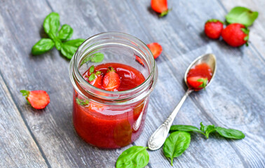 Home made ketogenic   organic  bio strawberry jam and fresh strawberryes  on wooden background. 
