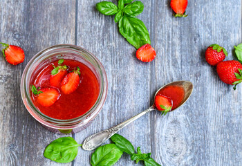 Home made ketogenic   organic  bio strawberry jam and fresh strawberryes  on wooden background. 