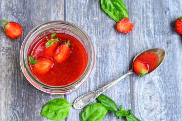 Home made ketogenic   organic  bio strawberry jam and fresh strawberryes  on wooden background. 