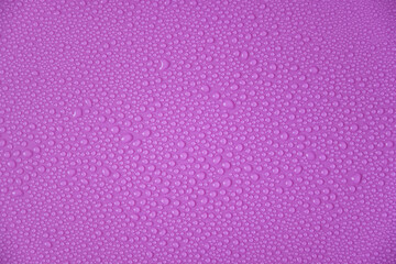 Water drops on a purple background.