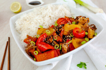 Close up Tofu with peppers, sesame seeds, basmati rice and soy sauce. Vegan recipe. Healthy recipe