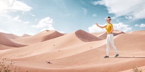 Female in Virtual Reality Headset Walking in a Desert at Sunny Day.