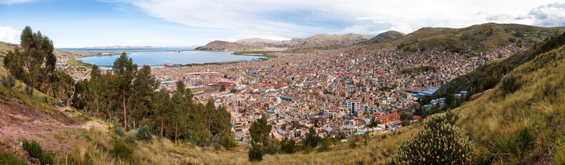 Fototapeta na wymiar Puno city and Titicaca lake panoramic view from Peru