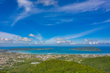 aerial panorama view Chalong gulf in blue sea. Loan island is close to Chalong pier..Houses, buildings of Phuket Town.
