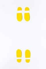 Social distance concept with paper footprints. Top view