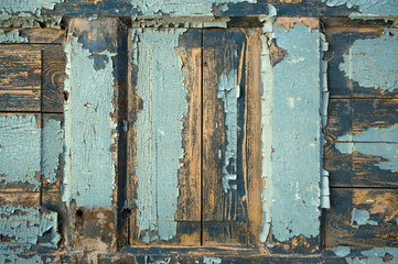 Old wooden door element. Blue paint 