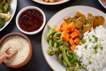Healthy Organic Tofu and Rice Buddha Bowl with Veggies. Poke bowl with silken tofu, rice and mixed vegetables, carrots, asparagus, tomatoes, beans . Healthy vegetarian salad bowl.