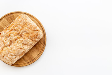 Fresh bread ciabatta loaf top view. Bakery background