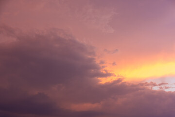 Naklejka na ściany i meble Cloudy stormy sunset with fiery orange glow