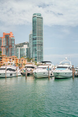 Fototapeta na wymiar boats in marina south Pointe Miami Beach florida buildings hotel yachts panorama summer sky 
