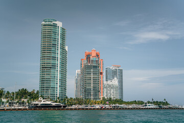 Fototapeta na wymiar residential area Miami Beach south pointe buildings park blue sky sea boats marina 