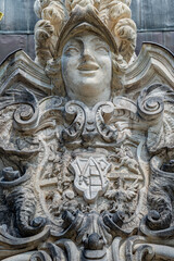 Old statue of a sensual Baroque Era woman in downtown of Dresden, Germany, details, closeup.