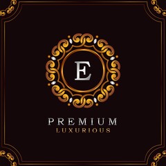Golden Premium Luxury Mandala Badge Letter E Logo Design. Elegance Ornate Decoration Mandala Badge On Golden Frame .