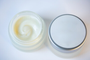 Cream in a jar on a white background