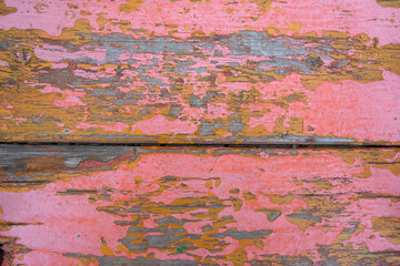 old painted wood wall with basic pink and orange color