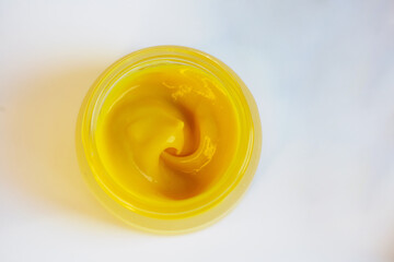 Cream in a jar on a white background