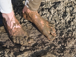 Muddy Feet of a Young Woman