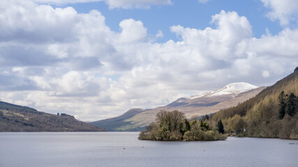 Fototapeta na wymiar View of Loch Tay with clouds and snow on mountains