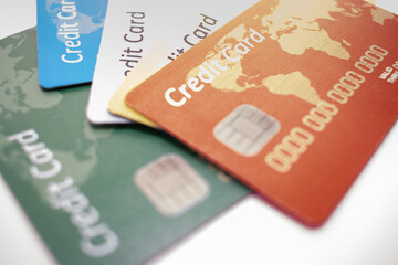 different color chipped credit card lying on white bacground
