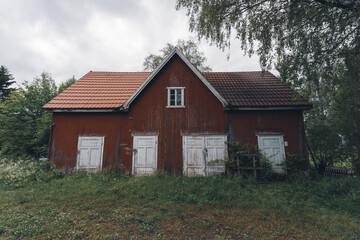 Fototapeta na wymiar Red barn on abandoned farm.