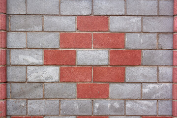 Part of fence made of blocks with red pattern. Horizontal image.
