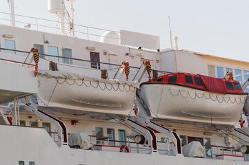 Naklejka premium Safety lifeboat on deck of a passenger ship