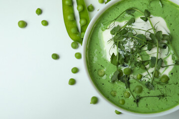 Concept of tasty eating with pea soup on white background