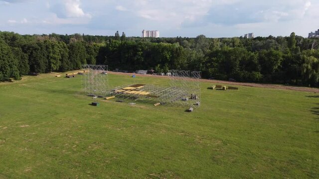 installation of a stage for a concert in the park aerial filming video