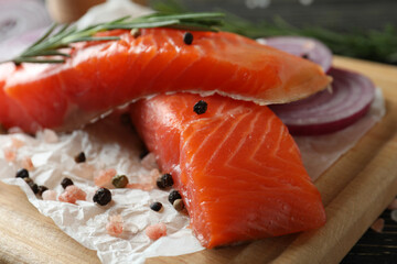 Fresh raw salmon and ingredients for cooking, close up