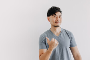 Fototapeta premium Happy face of Asian man look at an empty space isolated on white background.