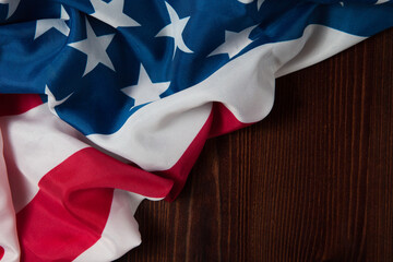 Closeup of American flag on wooden background
