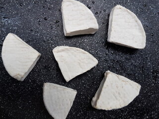 Camembert on black background