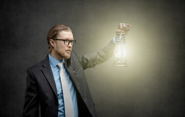 businessman lightened with kerosene lamp
