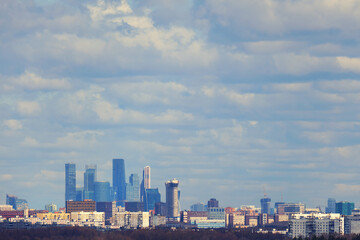 Fototapeta na wymiar Moscow city against a blue sky with clouds
