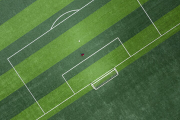 Aerial top view of a goalkeeper standing in front of the goal
