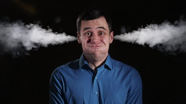 Man letting off steam from his ears
