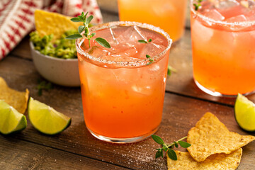Spicy grapefruit margarita with chips and guacamole