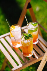 Summer cocktails. Alcoholic cocktail with ice and citrus fruits. Summer holiday tropical concept.