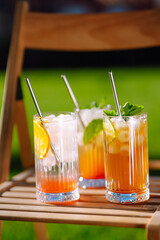 Summer cocktails. Alcoholic cocktail with ice and citrus fruits. Summer holiday tropical concept.