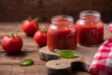 Fototapeta na wymiar Traditional homemade tomato sauce and tomatoes