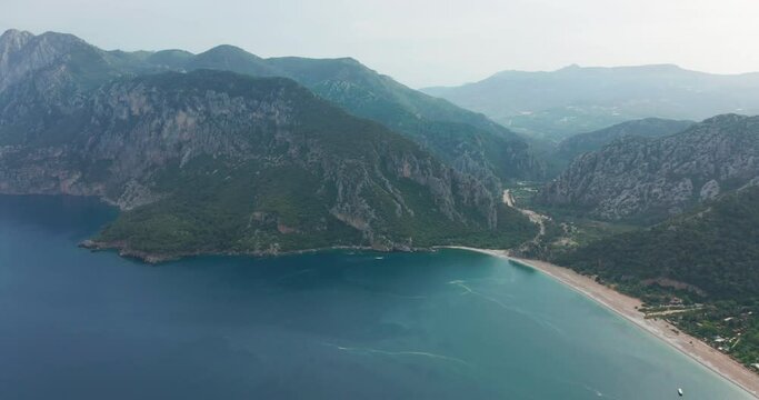 Aerial drone of Cirali beach and Olympos Olimpos mountain in a beautiful day light. Kemer, Antalya, Mediterranean region, Turkey, Lycia. Perfect sea view, nice for eyes of traveler.