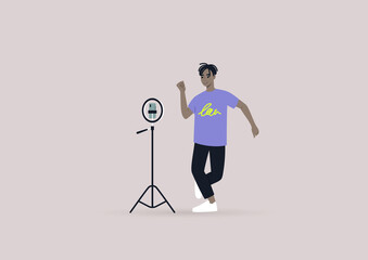 Fototapeta premium A young male Black character recording a dancing challenge video with their mobile phone on a tripod, modern gen z lifestyle