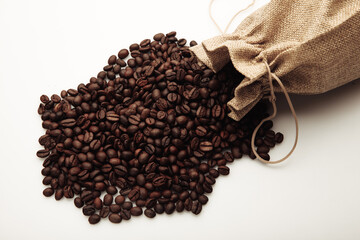 Roasted coffee beans scattered of the bag