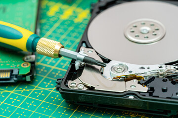 hard disk drive disassembling process with screwdriver in information recovery, repair HDD service