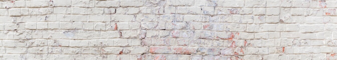 Panoramic scenery with brick wall with peeling plaster