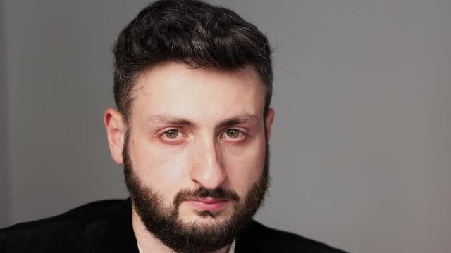 Sad man looks on the camera. Close up. bearded man depressed