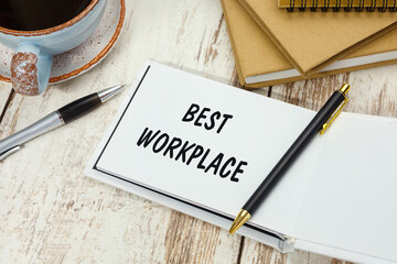 Handwriting text BEST WORKPLACE on the notepad